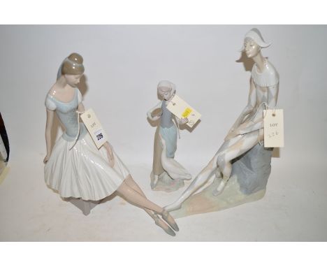 Two Nao figurines of a ballerina and a musician; together with a Lladro figure of a girl and goose. (3)