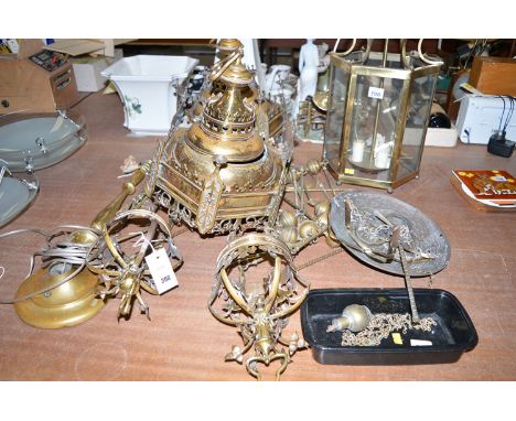 A pair of large brass early 20th Century ornate hanging lanterns with hexagonal shades and plain links connecting them into a