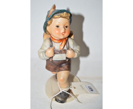 A large Hummel ware figure of a paper label titled 'School Boy'.