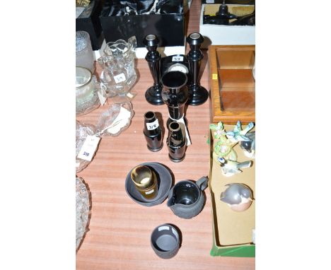 A garniture of black glass vases with silver coloured decoration; a pair of turned ebony candlesticks; a small mantel clock; 