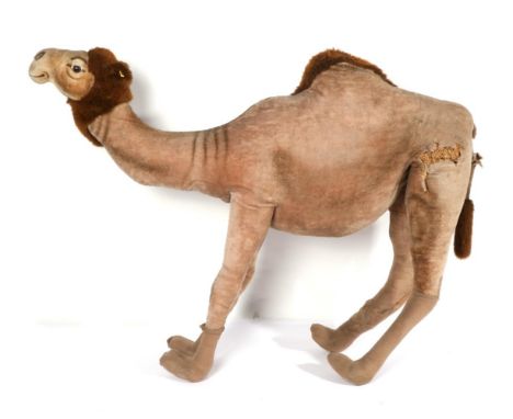 An 'enormous' Steiff straw filled camel, bearing the Steiff button and woven yellow tag, nose to tail 168cm, foot to nose 130