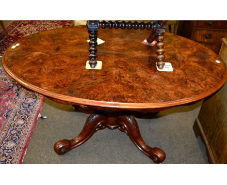 A Victorian oval shaped walnut veneered tripod loo table 