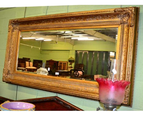 A rectangular gilt framed overmantel mirror 