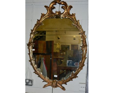 An 18th century style gilt oval mirror 