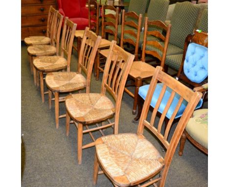 A set of six rush seated chairs and a set of four elm rush seated ladder back chairs 