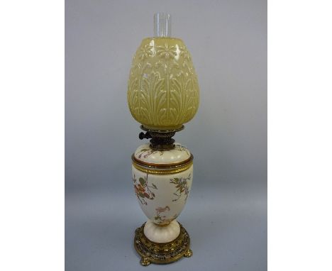 A ROYAL WORCESTER OIL LAMP, the baluster body decorated with floral sprays, Hinks & Sons burner, relief floral moulded opaque