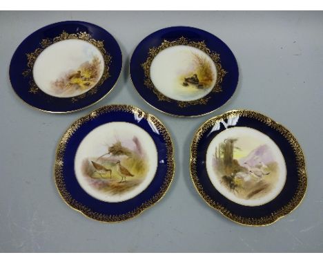 FOUR ROYAL WORCESTER CABINET PLATES, signed Johnson, with cobalt and gilt borders, Water hen and Grouse with puce marks, circ