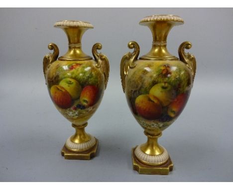 A NEAR PAIR OF ROYAL WORCESTER SLENDER URN VASES, decorated with apples and cherries on mossy bank, on shaped plinth bases, g