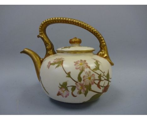A ROYAL WORCESTER IVORY PORCELAIN TEAPOT AND COVER, with floral spray decoration, gilt up and over handle, spout and final, p