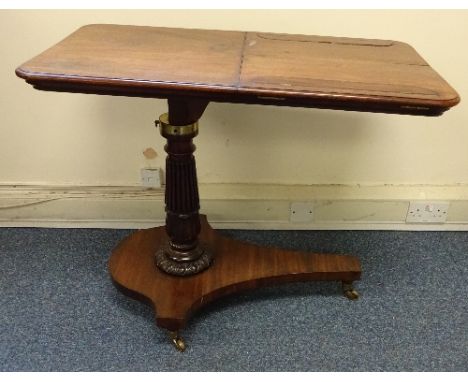 A VICTORIAN MAHOGANY OVER BED/BEDSIDE TABLE, on reeded column support and shaped plinth supported on shaped turned feet with 