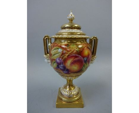 A ROYAL WORCESTER TWIN HANDLED URN AND COVER, hand painted with apple, grapes, peaches and cherries, with gilt and cream high