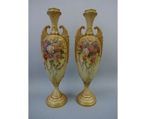 A PAIR OF ROYAL WORCESTER BLUSH IVORY TWIN HANDLED VASES, signed W Hale, with hand painted floral and swag decoration to body