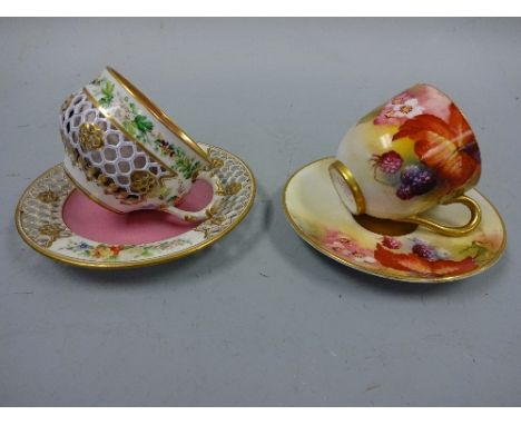 TWO ROYAL WORCESTER CABINET CUPS AND SAUCERS, autumnal leaves and berries, signed K Blake, puce marks, circa 1929 and floral 