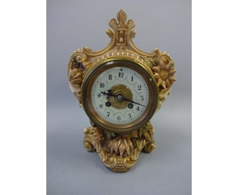 A ROYAL WORCESTER PORCELAIN MANTEL CLOCK, stylised shield shape case with rococco style scrolling and beading, moulded floral