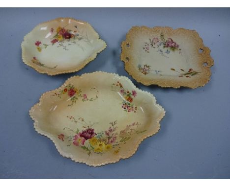 THREE ROYAL WORCESTER BLUSH IVORY FLORAL SPRAY DECORATED PLATES, shaped square example with pierced scrolls, green marks to b
