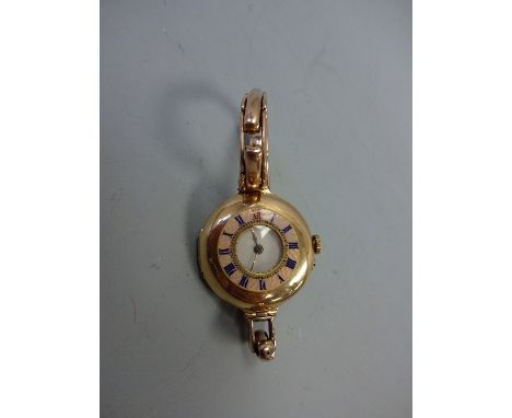 A LADIES WATCH, c.1900,  with pink guilloche enamel case with Roman numeral detail, with expandable strap, stamped 14C, cylin