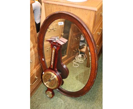 Barometer and a Oval bevel edged mirror 