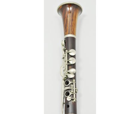 Walnut and rosewood clarinet, (cased).