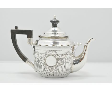 Edwardian silver teapot, London 1903, embossed and lightly fluted, composition handle and finial, 9ozs gross, 14cms.
