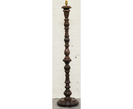 Stained wood standard lamp, carved tulip head decoration, 132cms.