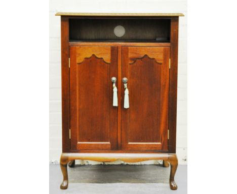 Mahogany finish side cabinet, with an open shelf over two arched panel doors, short cabriole legs, width 69cms.