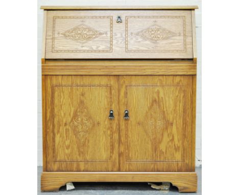 Light oak finish bureau, fall front enclosing a part fitted interior, two doors below, width 86cms.