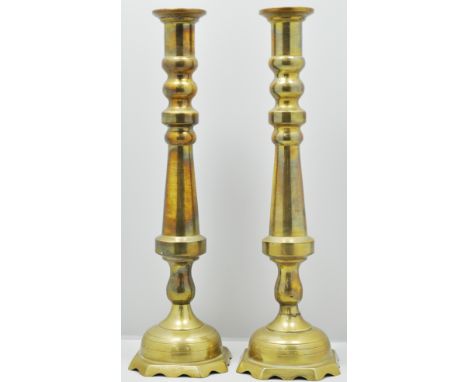 Pair of tall brass candlesticks, 49cms, an alabaster lamp base and two bone china lamp bases, (5).