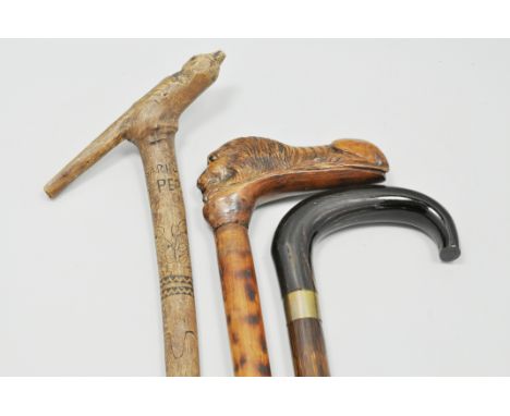 Central American walking stick, carved decoration and two other walking sticks, (3).