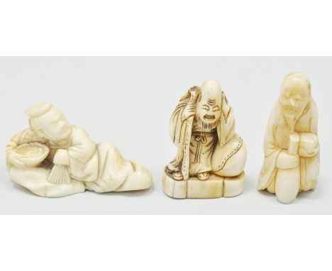 Japanese carved ivory netsuke, probably Mehji, designed as a reclining figure, 6cms and two others, (3).