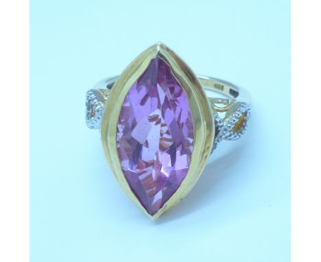 A silver gilt, navette pink quartz ring with diamond accents, R