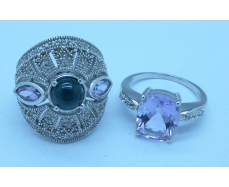 Two gem set silver rings, O and R