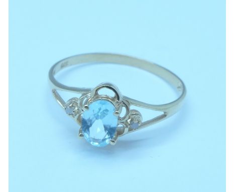 A 9ct gold, blue topaz and diamond ring, 1g, O