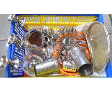 A collection of plated ware including a candelabra, a basket, coaster, cruet, etc.