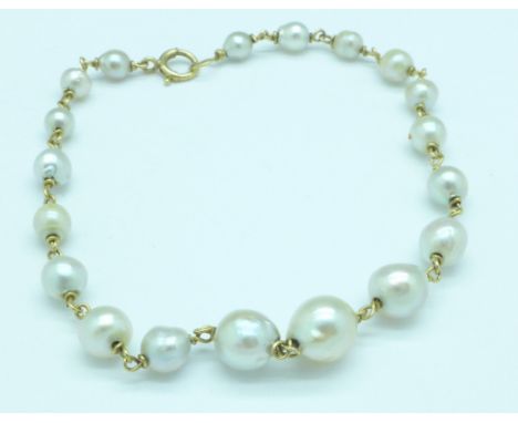 A 14ct gold and natural pearl bracelet