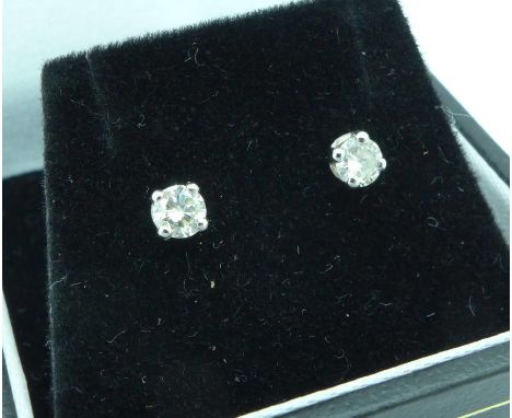 A pair of 18ct white gold and diamond stud earrings, total diamond weight 0.34ct