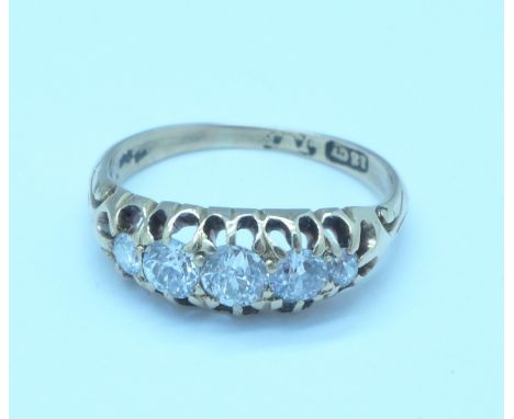 An 18ct gold and five stone diamond ring, 2.7g, J