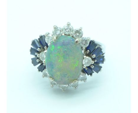 An 18ct white gold, opal, diamond and sapphire ring, 7.4g, O, opal 11mm x 8mm, approximately 0.75 carat total diamond weight