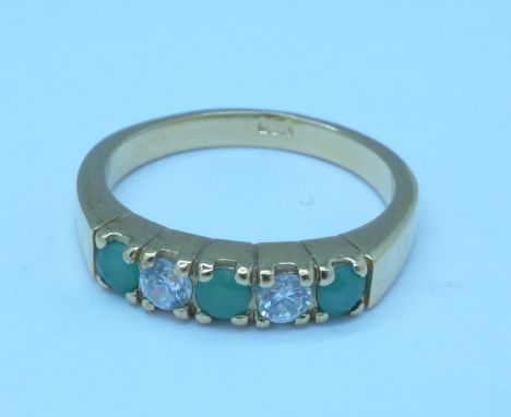 A silver gilt, white stone and emerald ring, N