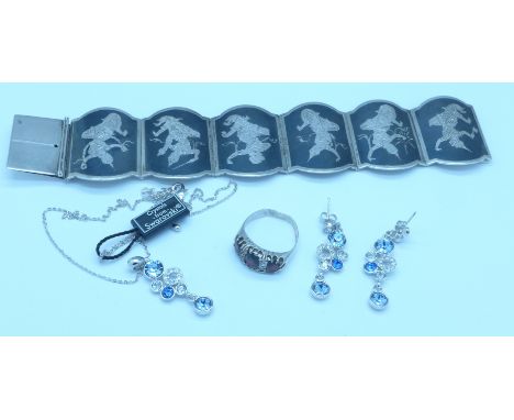 A silver ring, a bracelet and a Swarovski crystal set pendant and matching earrings