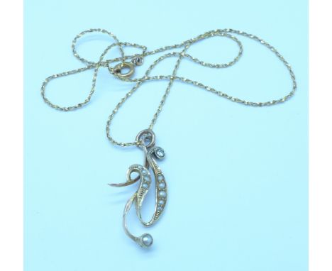 A 15ct gold, diamond and pearl pendant
