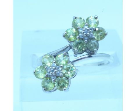 A 9ct white gold, peridot and diamond double cluster ring, 3.1g, P