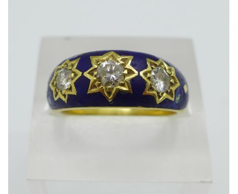 An 18ct gold, three stone diamond and blue enamel ring, 11.3g, S, approximately 0.75 carat total diamond weight, enamel a/f