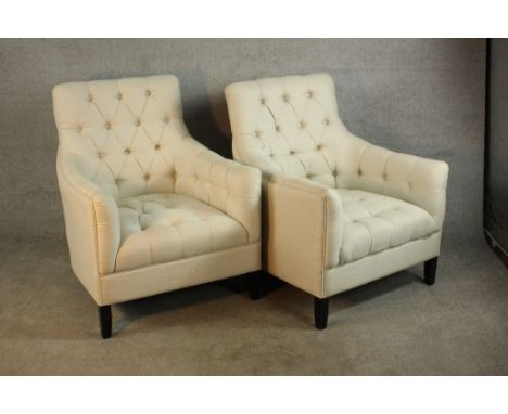 A pair of early 20th century mahogany framed button upholstered armchairs raised on tapering supports H.83 W.78 D.98cm. (each
