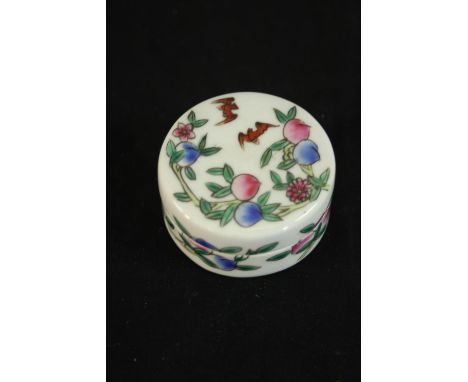 A Chinese early 20th century Famille rose hand painted peach and lucky bat design porcelain lidded seal box. H.3 Dia. 5cm. 