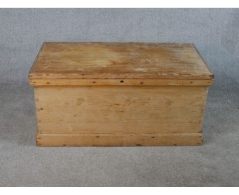 A late 19th / early 20th century stripped pine storage trunk. H.44 W.91 D.48cm. 