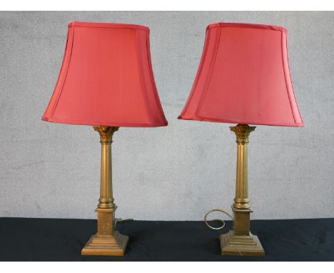 A pair of late 20th century Laura Ashley brass Corinthian column table lamps, with fluted stems and square step down bases, m
