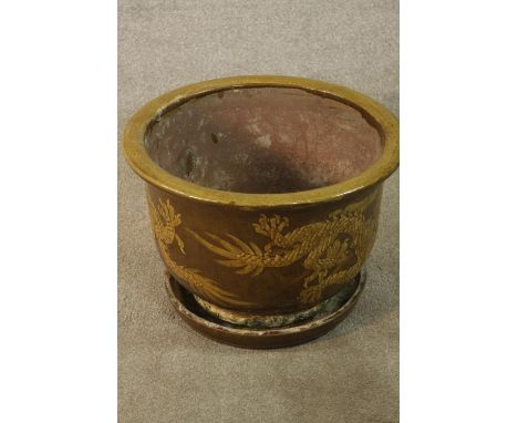 Chinese glazed pottery planter / jardinière and base with flying dragon decoration. H.39 Dia.49cm (largest) 