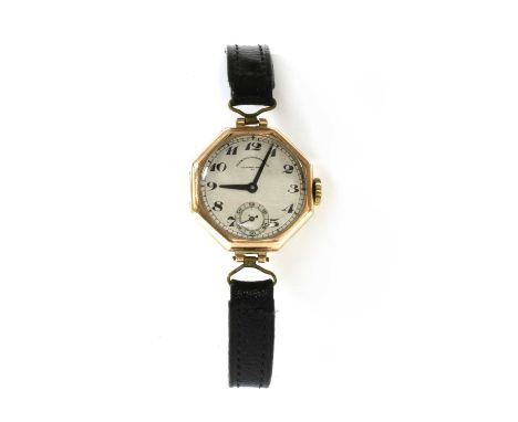 A ladies' 9ct gold Goldsmiths and Silversmiths Co. Ltd. mechanical strap watch, octagonal case, 27mm diameter, with a silvere