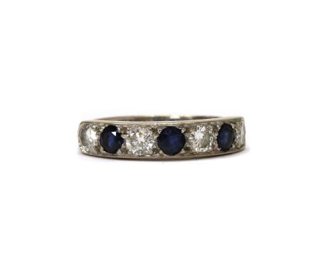 An 18ct white gold sapphire and diamond half eternity ring, a row of alternating circular mixed cut sapphires and brilliant c