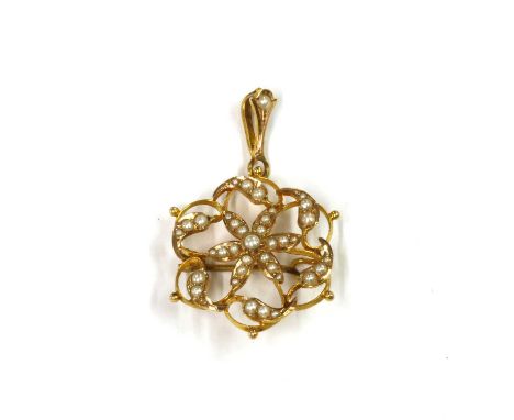 A gold split pearl pendant/brooch, a floral collet to the centre grain set with split pearls, to wire surround with foliate c